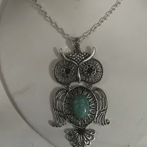 Silver plated owl pendant with turquoise stone